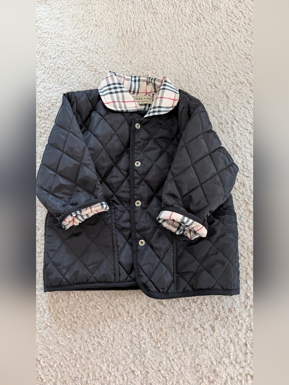 New, w/out tags, toddler black jacket w/ plaid lining